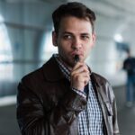 urban-lifestyle-portrait-of-a-man-vaping-near-the-airport-before-registration-with-custom-vape-mod-e1626686057708.jpeg
